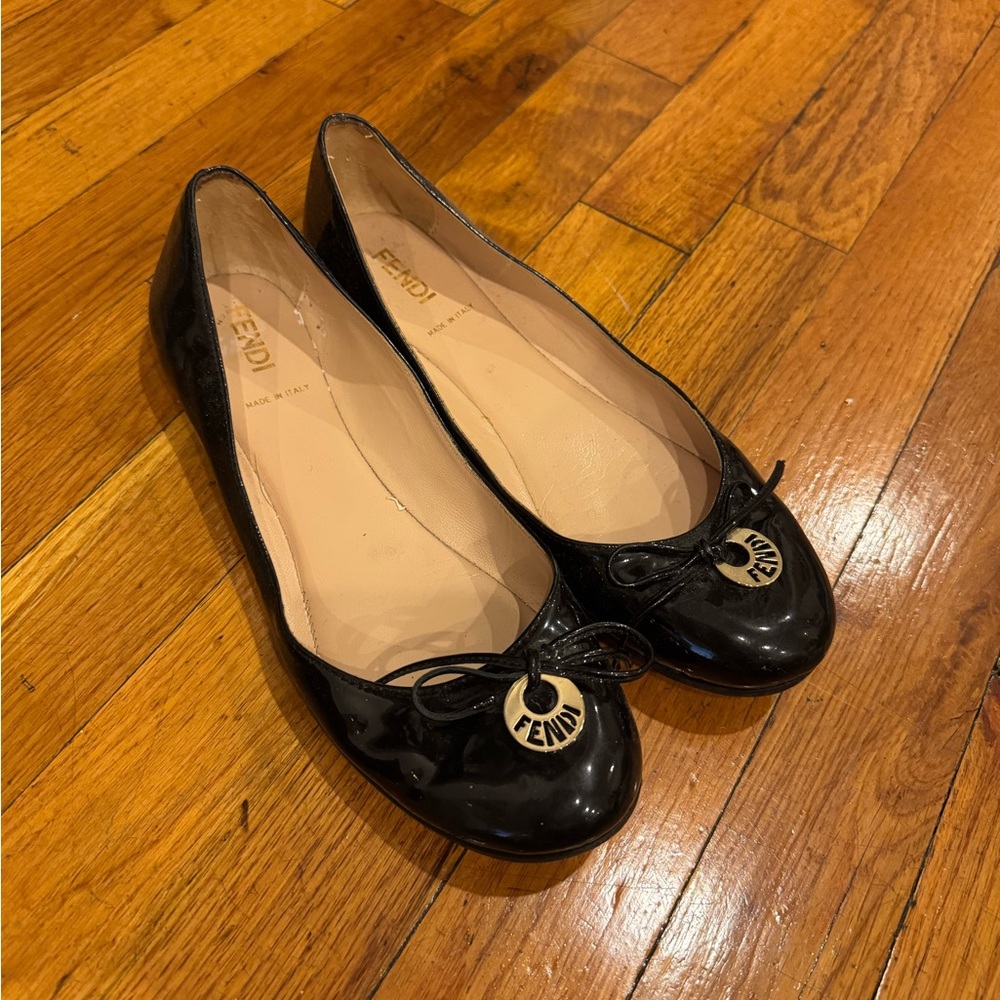 Fendi Glossy Black Flats with Logo Charm
